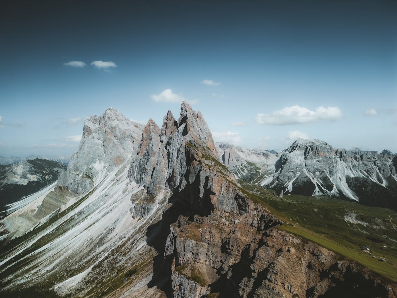 contact-img Stunning aerial view of the rugged Seceda mountain peaks in the Dolomites, Italy.